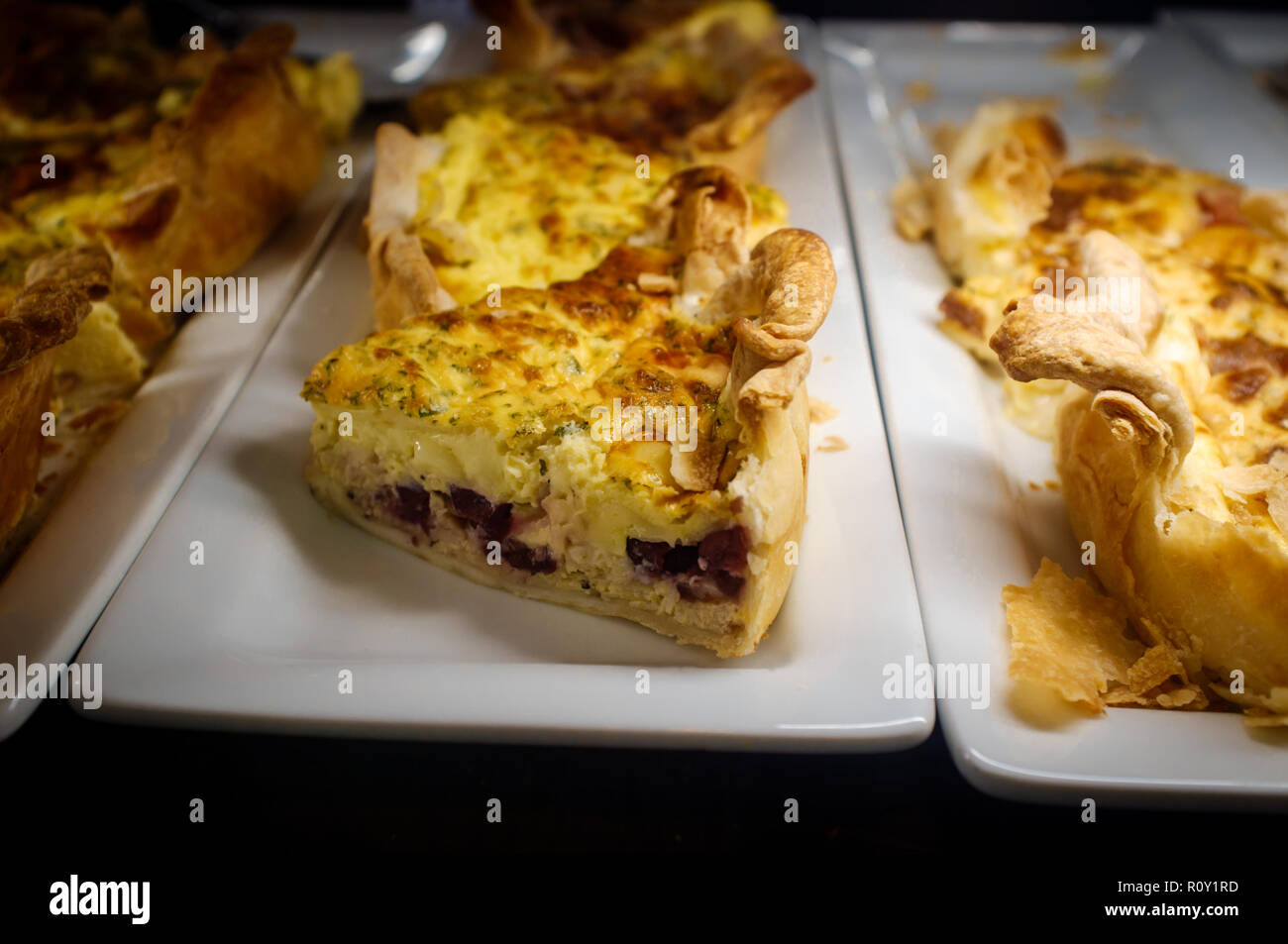 Healthy egg breakfast sliced quiche pie on display at local bakery