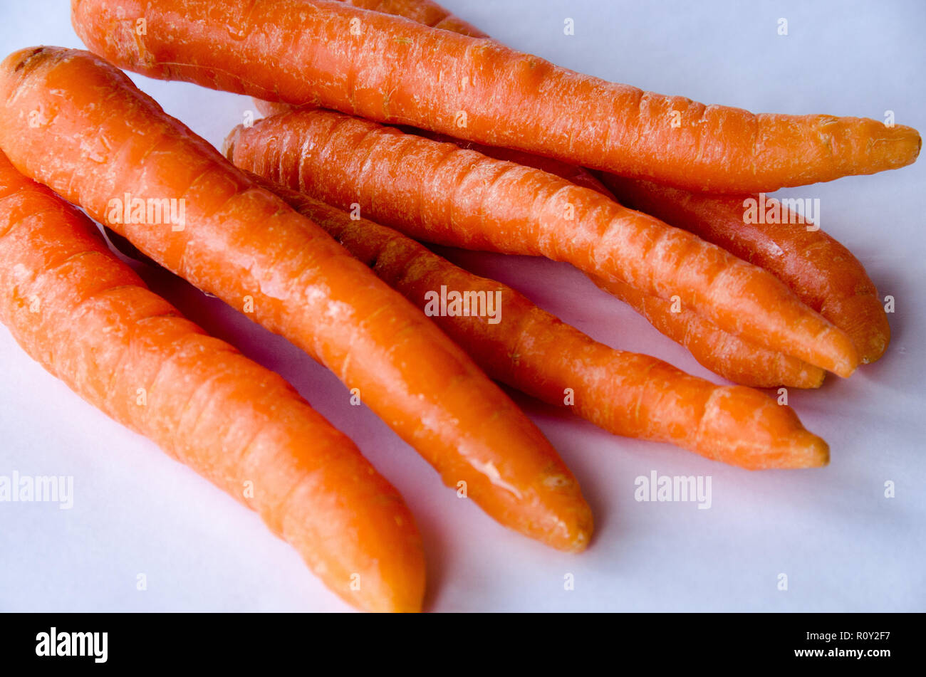 Carrots in group on white background Stock Photo