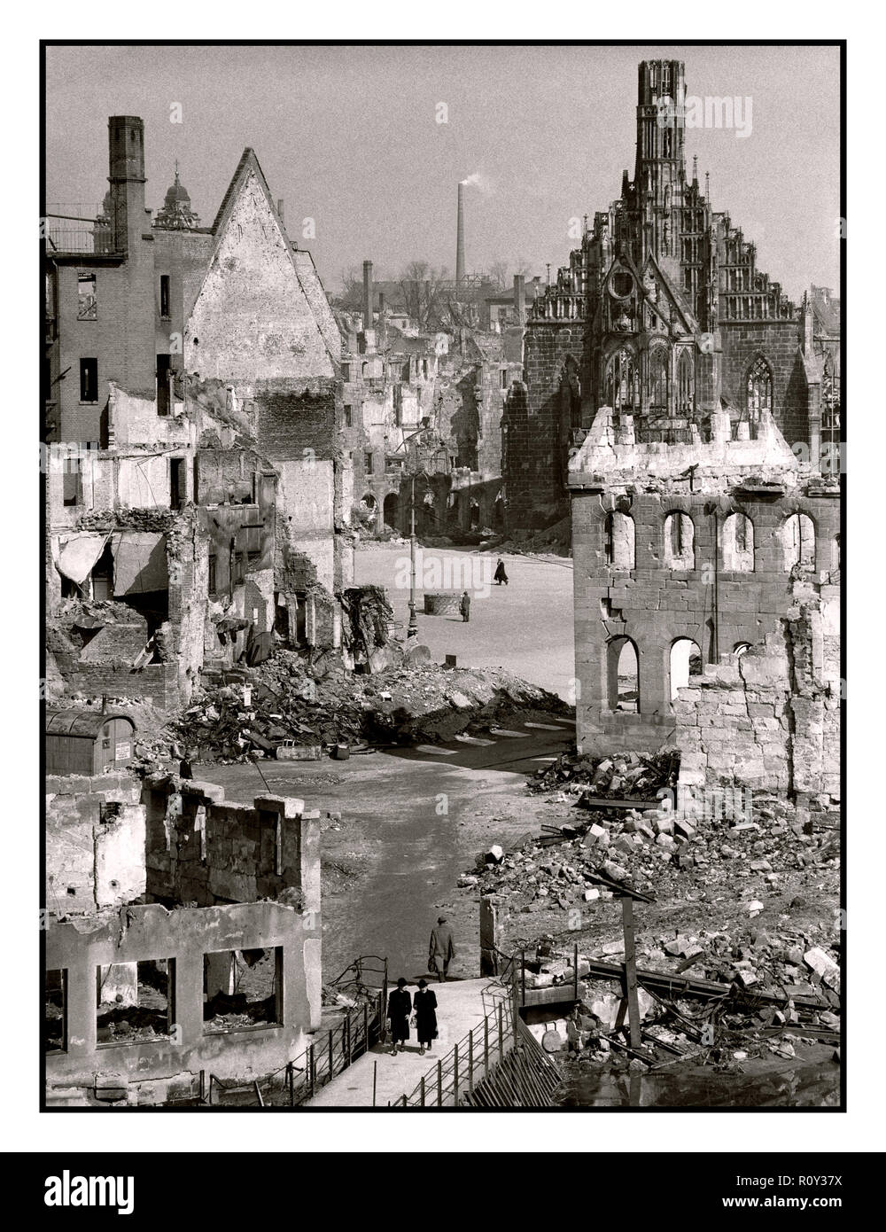 WW2 British bombing raid on Nazi Nuremberg City Germany with Gothic church in  background the Frauenkirche (Church of Our Lady) It was damaged by a British Bombing raid on the night of January 2, 1945. Stock Photo