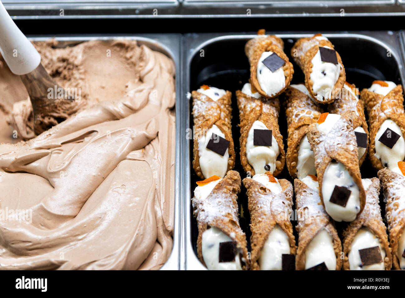 Display on trays in bakery, dessert shop, store selling cannoli with