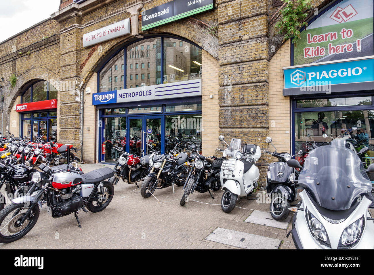London England,UK,Lambeth Vauxhall,sales dealer,stores,exterior,motorcycles,sports bikes,scooters,Ducati,Triumph,Piaggio,display sale,UK GB English Eu Stock Photo
