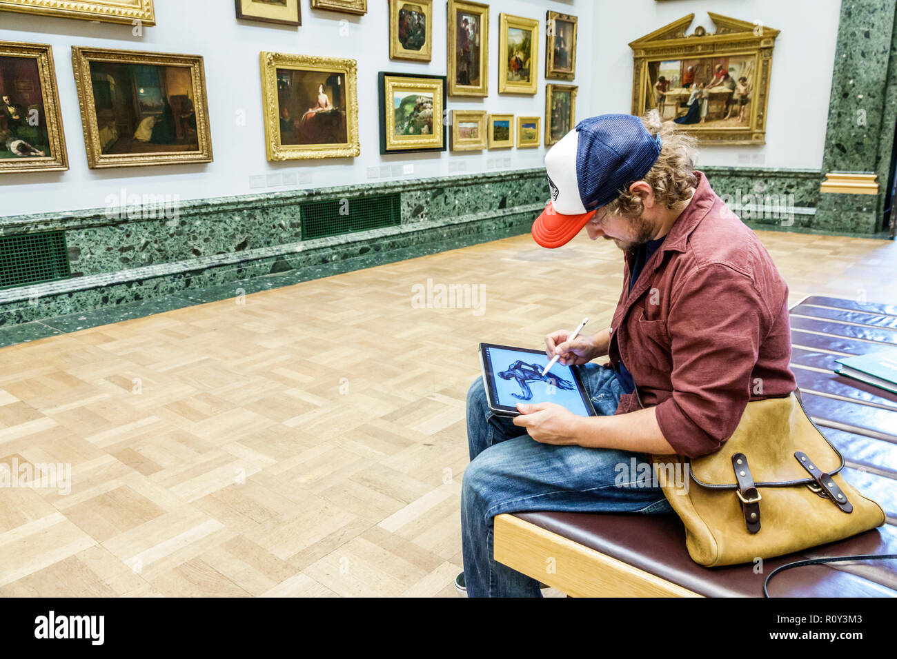 London England,UK,Westminster,Millbank,TateBritain art museum,inside interior,gallery,paintings,man men male,copyist,drawing,sketching,iPad tablet,sty Stock Photo