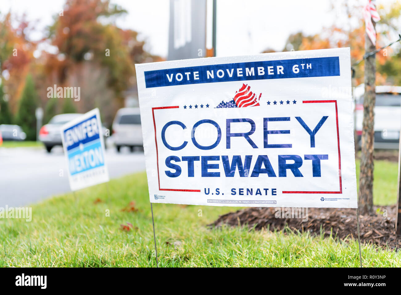 Herndon, USA - November 6, 2018: Democratic, Republican vote, election, voting signs at high school polling station for nominee, candidate Corey Stewa Stock Photo