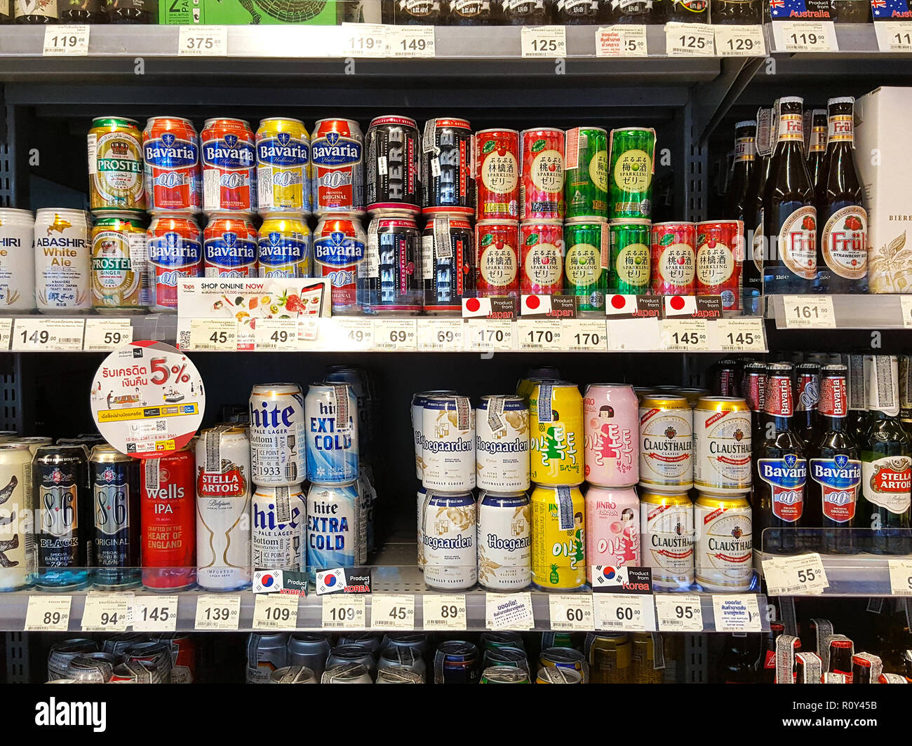 BANGKOK THAILAND OCTOBER 27 Beer rack many brands on supermarket stand. Various bottles and