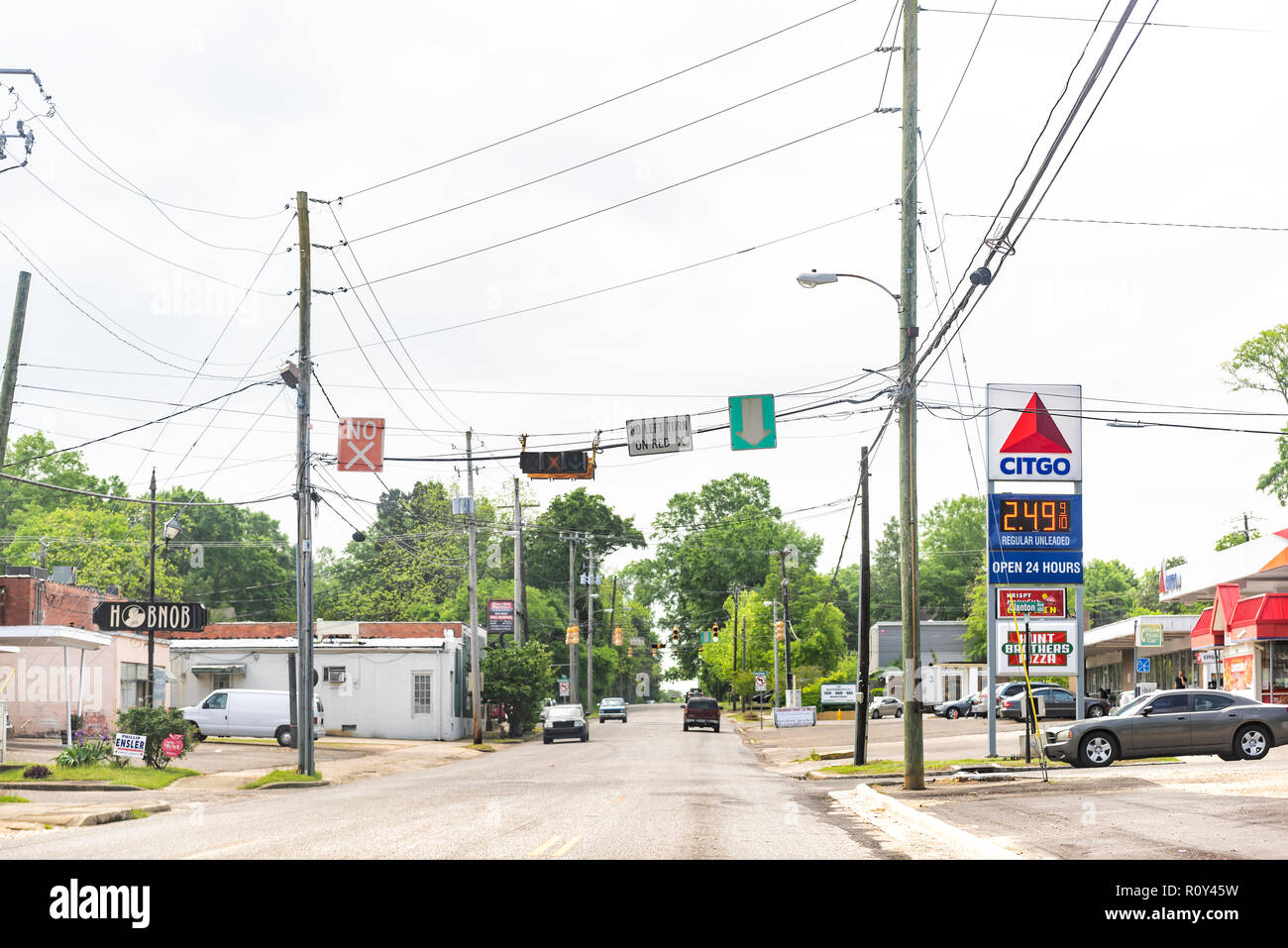 Montgomery, USA - April 21, 2018: Road street during day in capital Alabama city, cars in traffic, Citgo gas station, light Stock Photo
