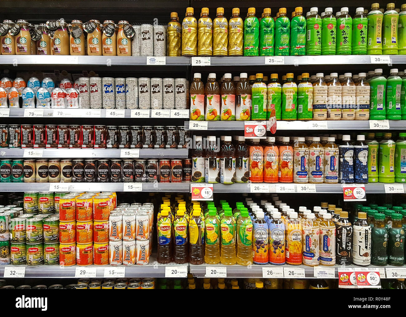 BANGKOK THAILAND - OCTOBER 27: Various bottles and cans of beverage Coffee, green tea stacked on shelves on supermarket stand. on October 27, 2018 in  Stock Photo