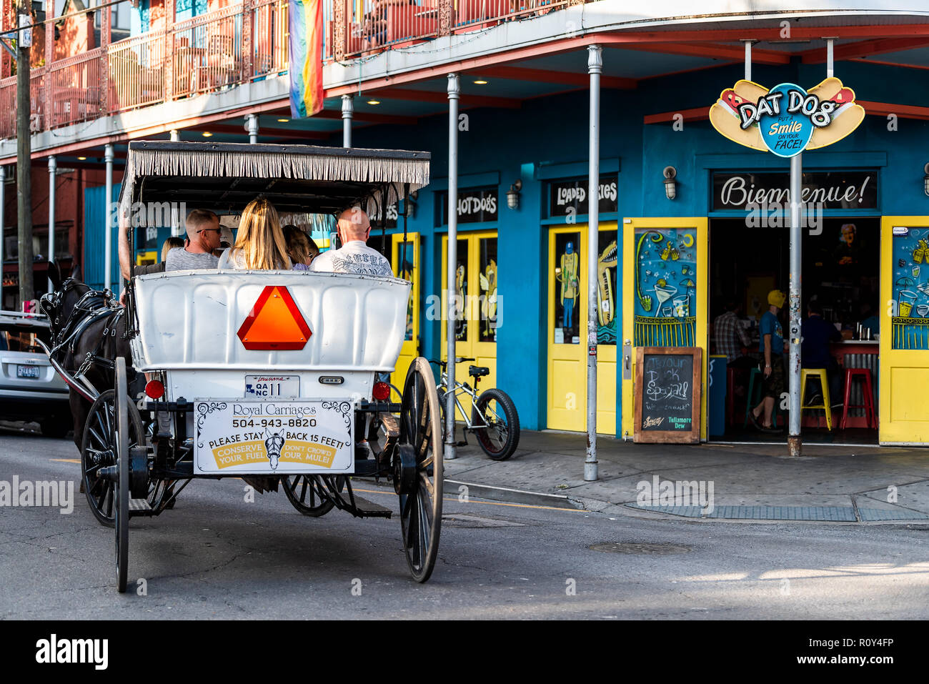 New Orleans, USA April 22, 2018 Restaurant Dat Dog selling hot dogs with horse carriage tour