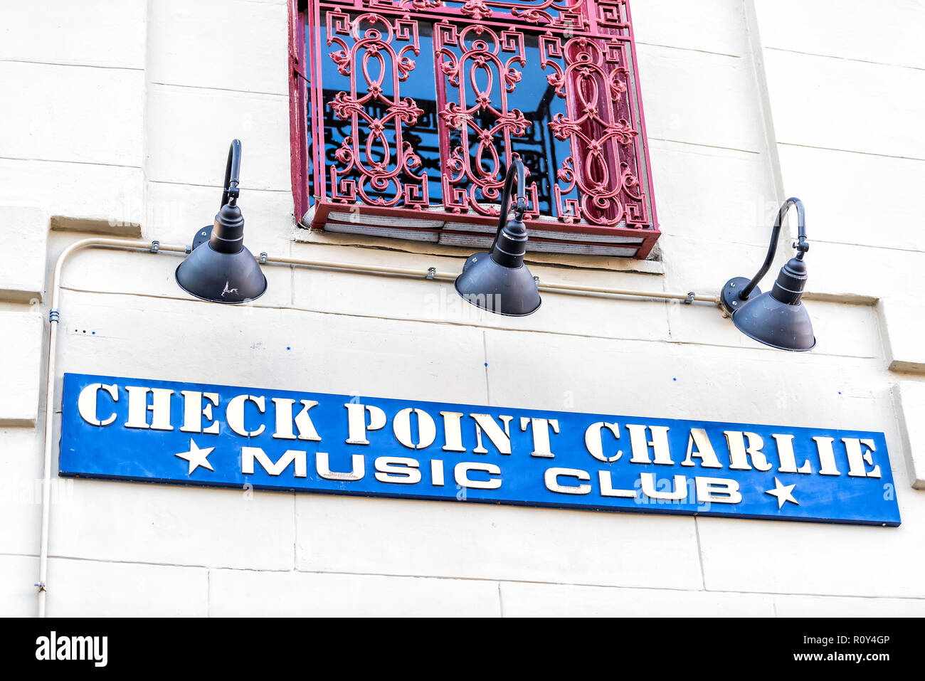 New Orleans, USA - April 22, 2018: Frenchmen street in Louisiana town, city, building, sign closeup for Check Point Charlie Music Club Stock Photo