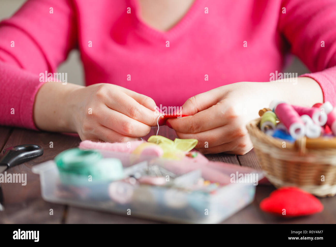 Doctor holding red toy heart hi-res stock photography and images - Alamy