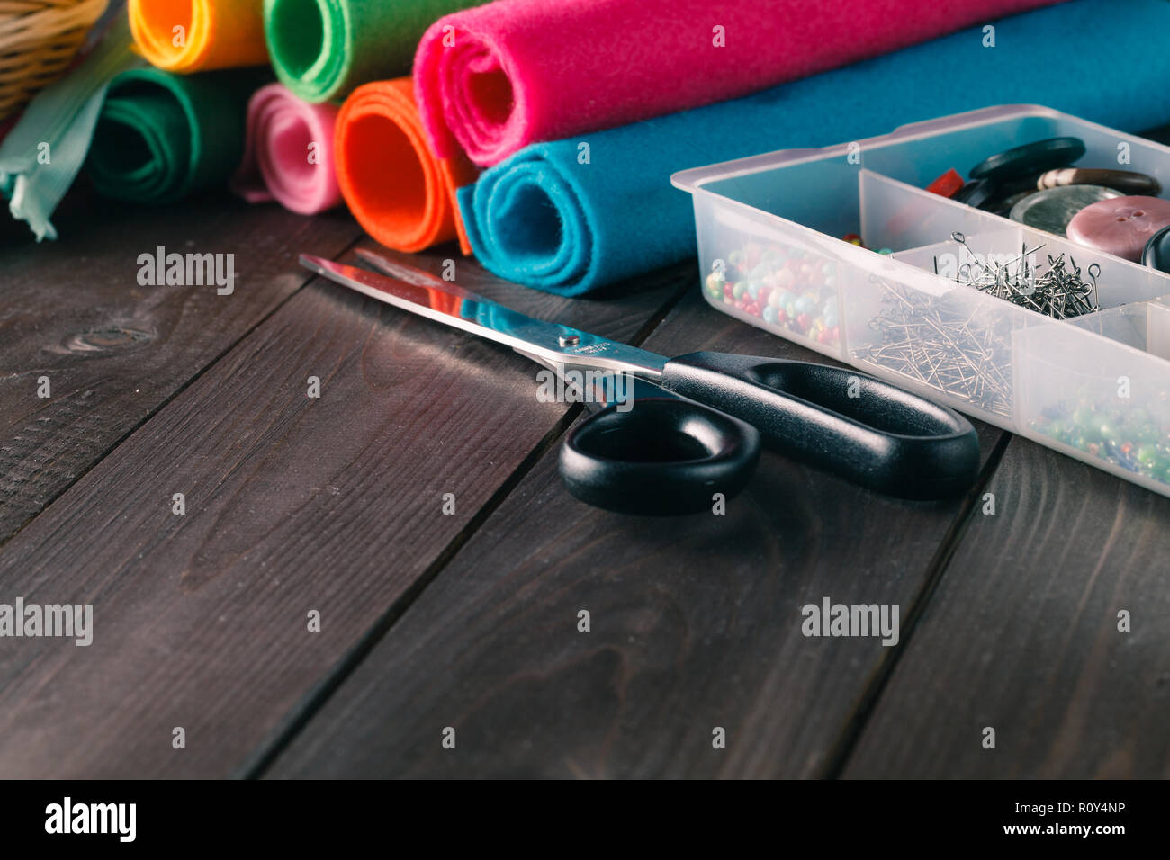 Sewing kit. Scissors, bobbins with thread, buttons and needles on