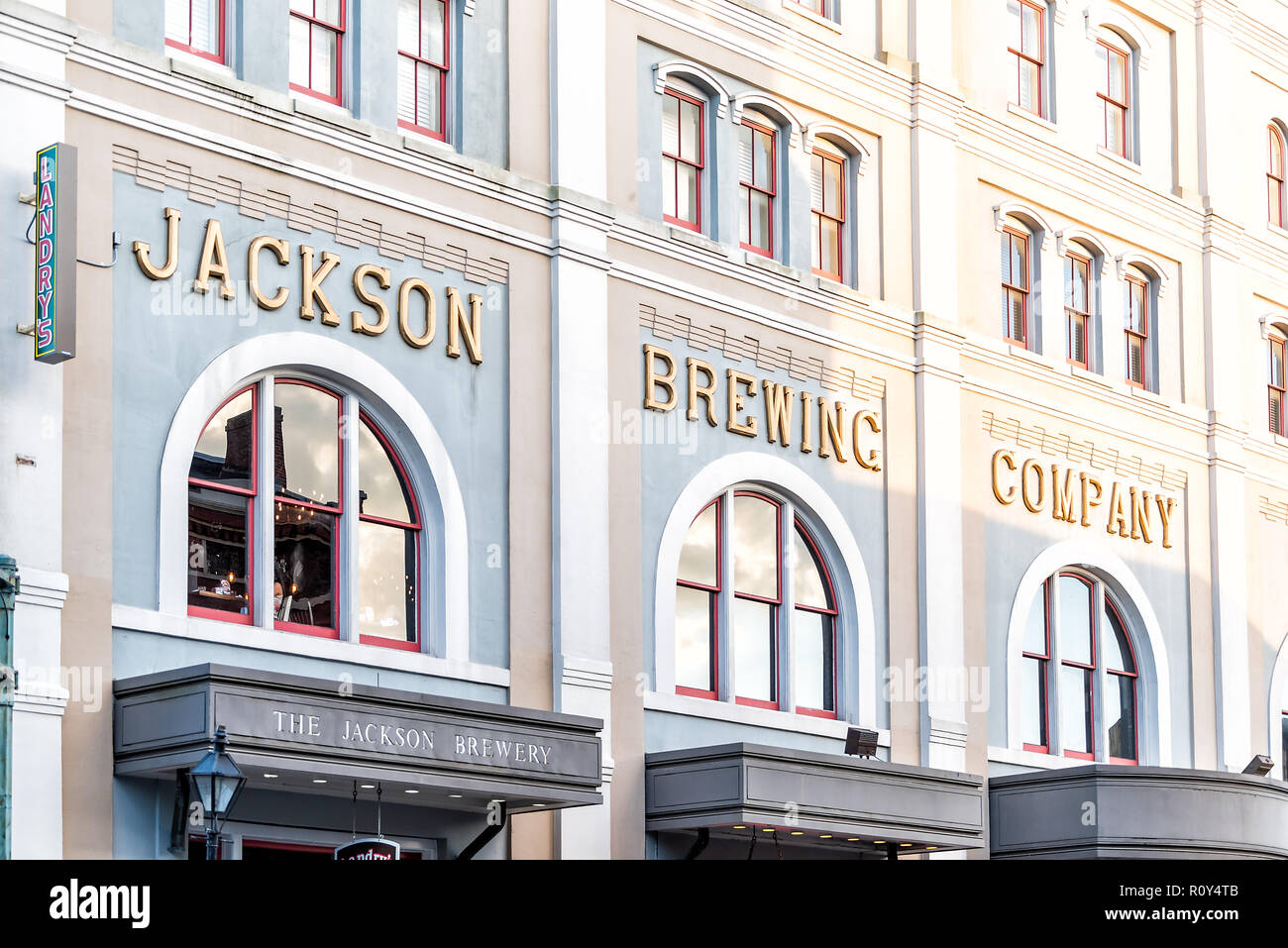 New Orleans, USA - April 22, 2018: Downtown old town Louisiana town city with famous historic building, Jackson Brewing Company Brewery Stock Photo