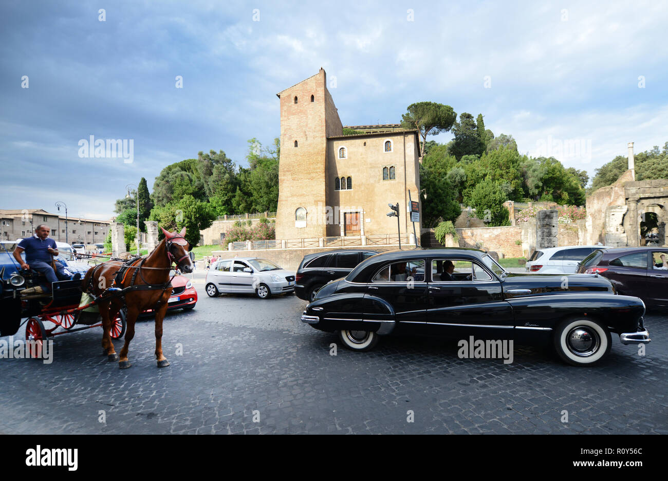 A 1950's American car taking a newly wed couple for a ride in Rome ...