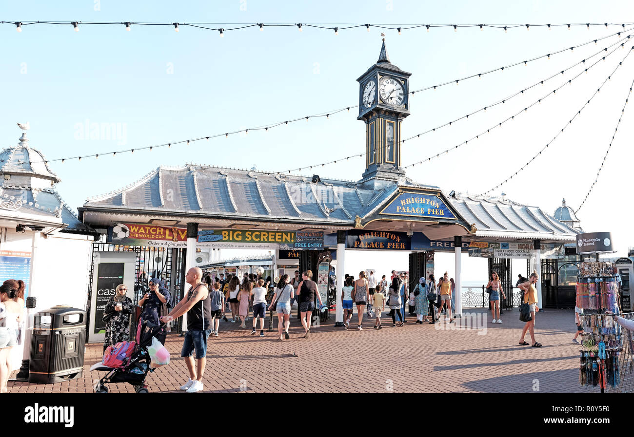 BRIGHTON, ENGLAND - JULY 9, 2018: Tourists in Brighton Palace Pier on Brighton beach, Brighton, UK. Stock Photo