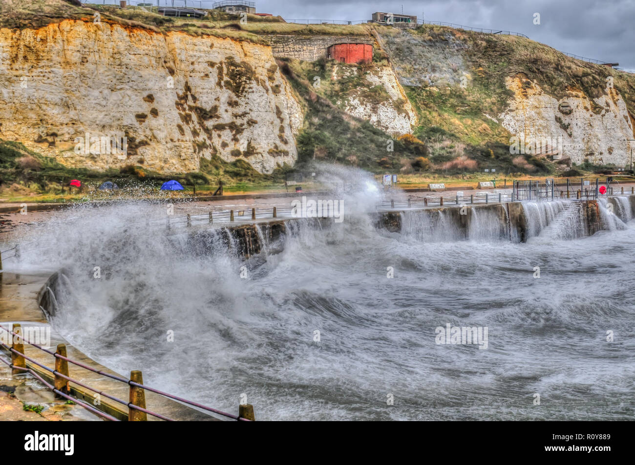 Newhaven, East Sussex, UK..7 November 2018..Strong wind from the South brings warmer air, & heavy rain showers, whiping up the waves on the South coast.. Stock Photo