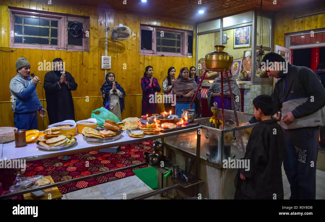 Srinagar, Kashmir. 7th Nov 2018. Kashmiri pandit devotees seen praying inside a temple on the occasion of Hindu festival diwali in the outskirts of Srinagar.Diwali, the Hindu festival of lights, marks the triumph of good over evil, and commemorates the return of Hindu deity Rama to his birthplace Ayodhya after victory against the demon king Ravana. Credit: Idrees Abbas/SOPA Images/ZUMA Wire/Alamy Live News Stock Photo