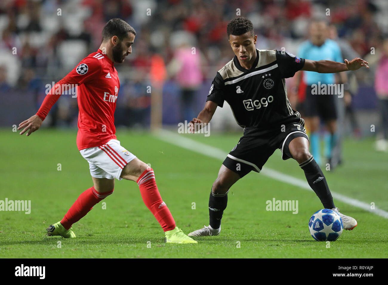Lisbon, Portugal, Portugal. 7th Nov, 2018. Rafa Silva of SL Benfica (L) vies for the ball with David Neves of FC Ajax (R) during the UEFA Champions League 2018/19 football match between SL Benfica vs FC Ajax. Credit: David Martins/SOPA Images/ZUMA Wire/Alamy Live News Stock Photo