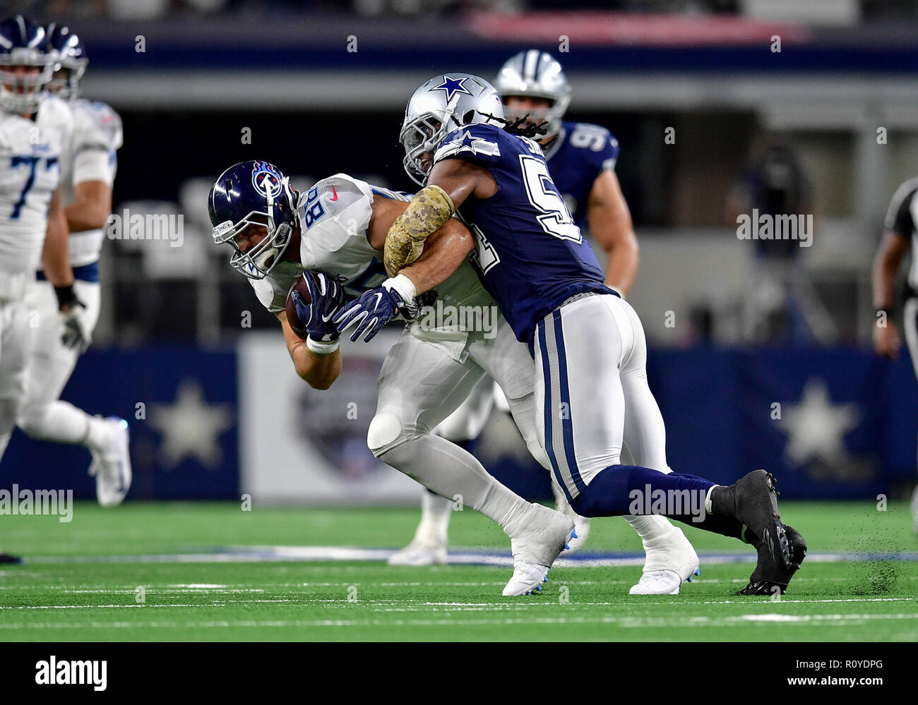 November 05, 2018:.Tennessee Titans quarterback Marcus Mariota (8)  scrambles for a first down during an NFL football game between the  Tennessee Titans and Dallas Cowboys at AT&T Stadium in Arlington, Texas.  Manny