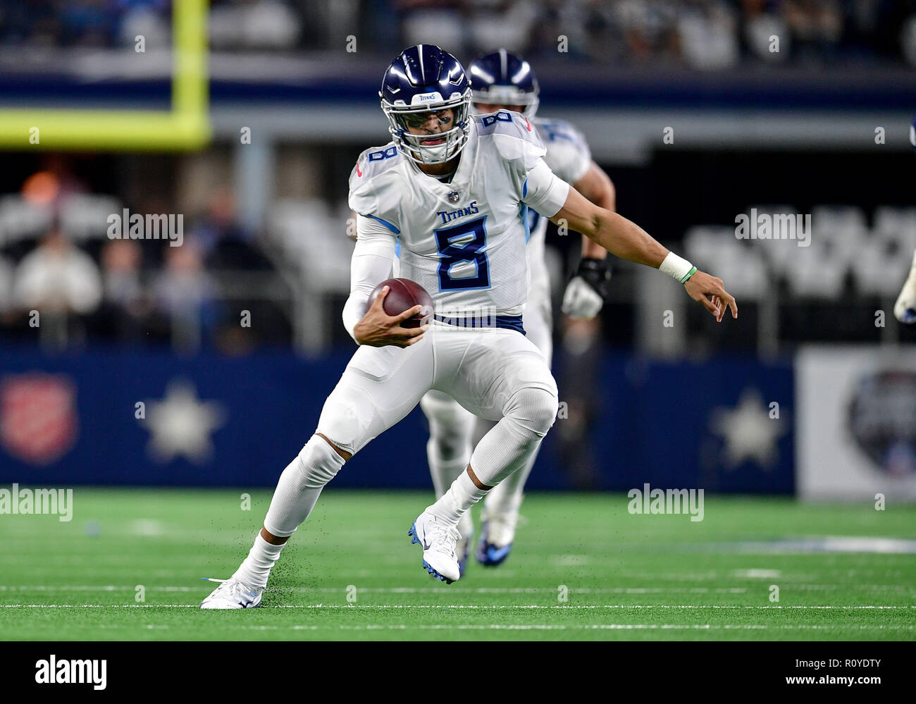 November 05, 2018:.Tennessee Titans quarterback Marcus Mariota (8)  scrambles for a first down during an NFL football game between the Tennessee  Titans and Dallas Cowboys at AT&T Stadium in Arlington, Texas. Manny