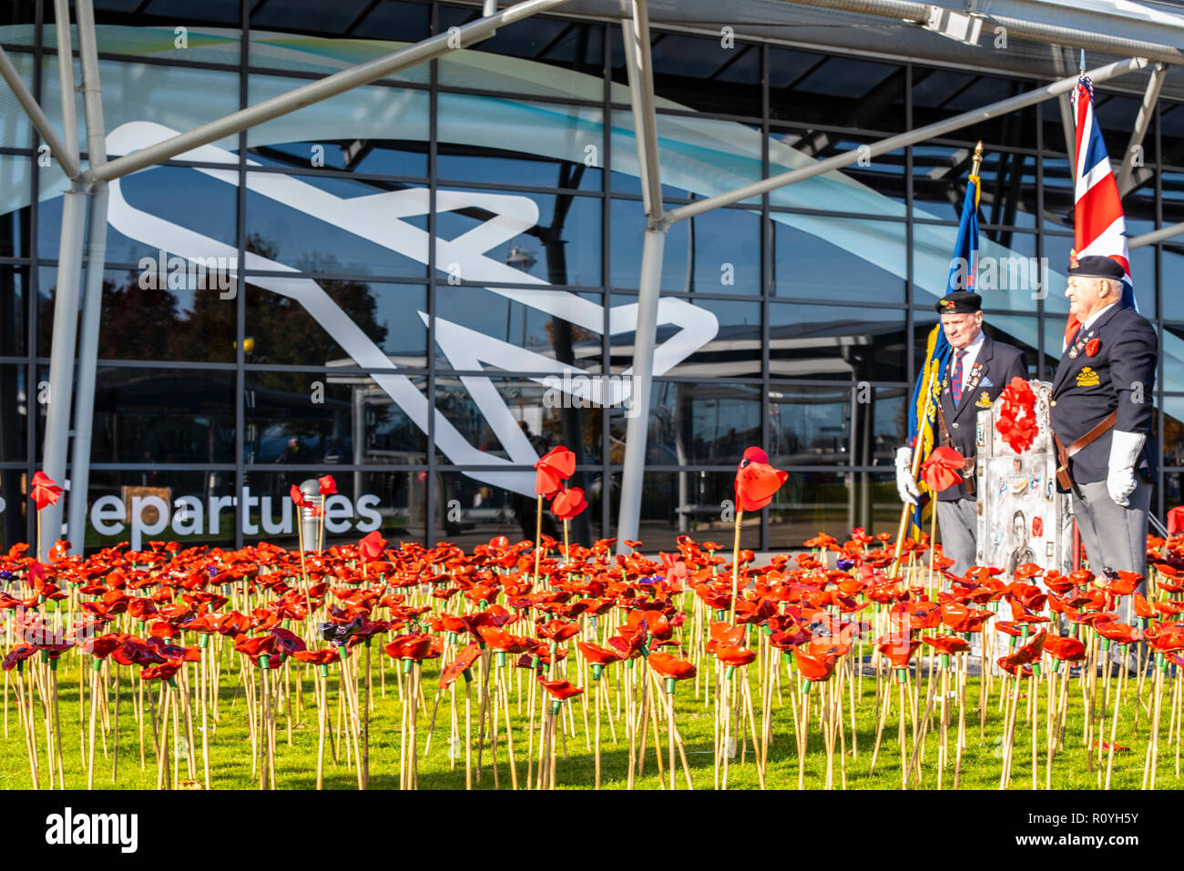 London Southend Airport, Essex, UK. To mark the centenary of the end of World War One a commemorative garden has been opened outside the terminal at London Southend Airport consisting of 2000 red ceramic poppies made by hundreds of children from 25 Southend schools. The airport served as RAF Rochford during both World Wars. Departures terminal Stock Photo