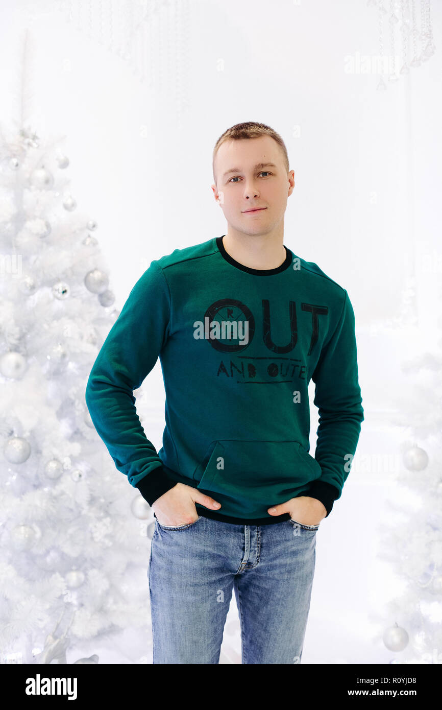 Handsome man posing in studio with white background. Stock Photo