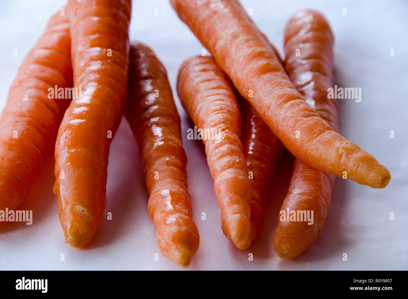 Carrots in group on white background Stock Photo