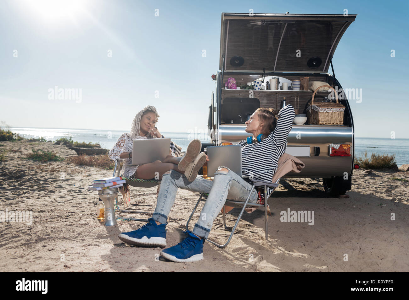 Travel managers working remotely using their laptops living in mobile