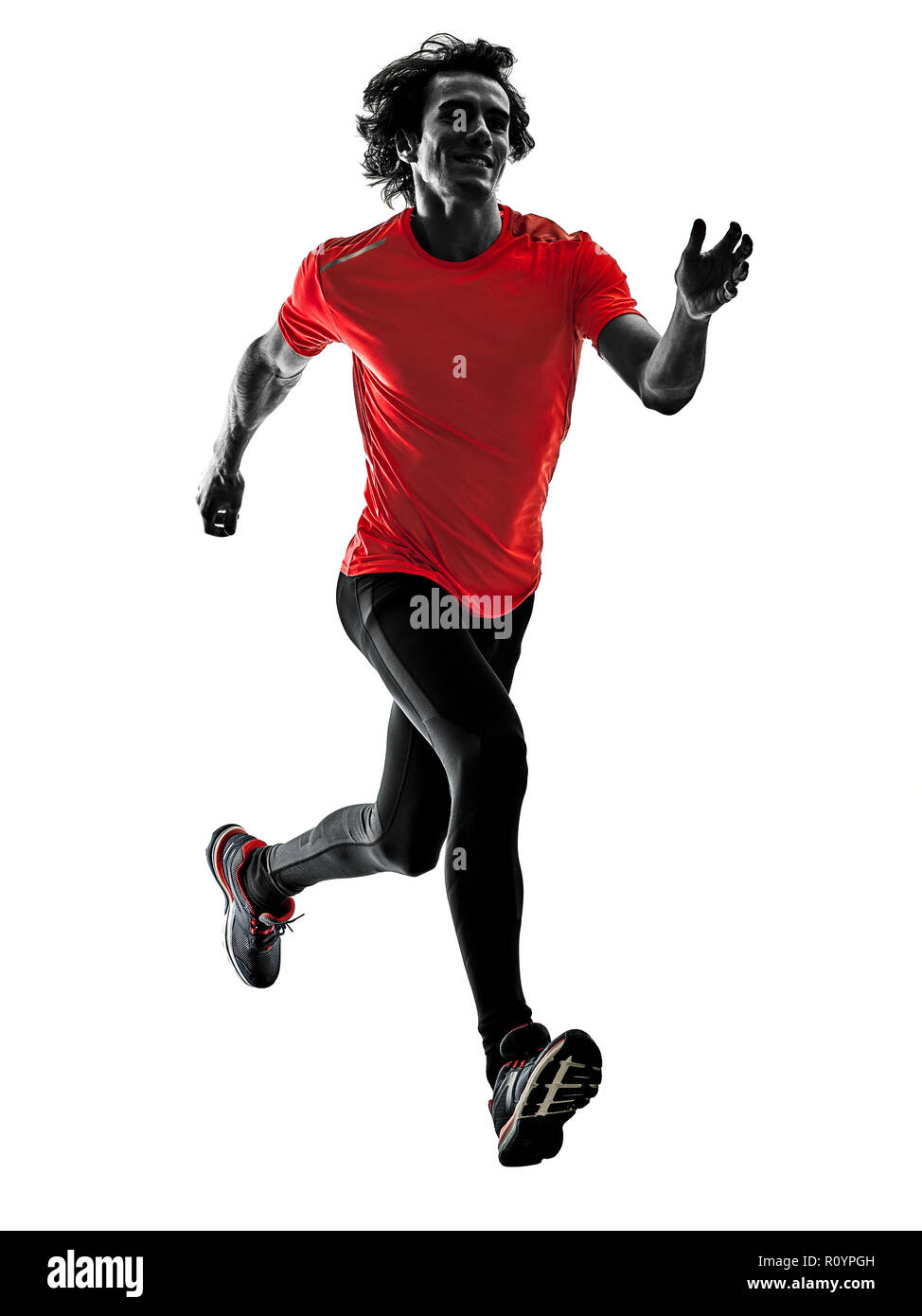 one caucasian man pratcticing runner running jogger jogging in studio silhouette isolated on white background Stock Photo