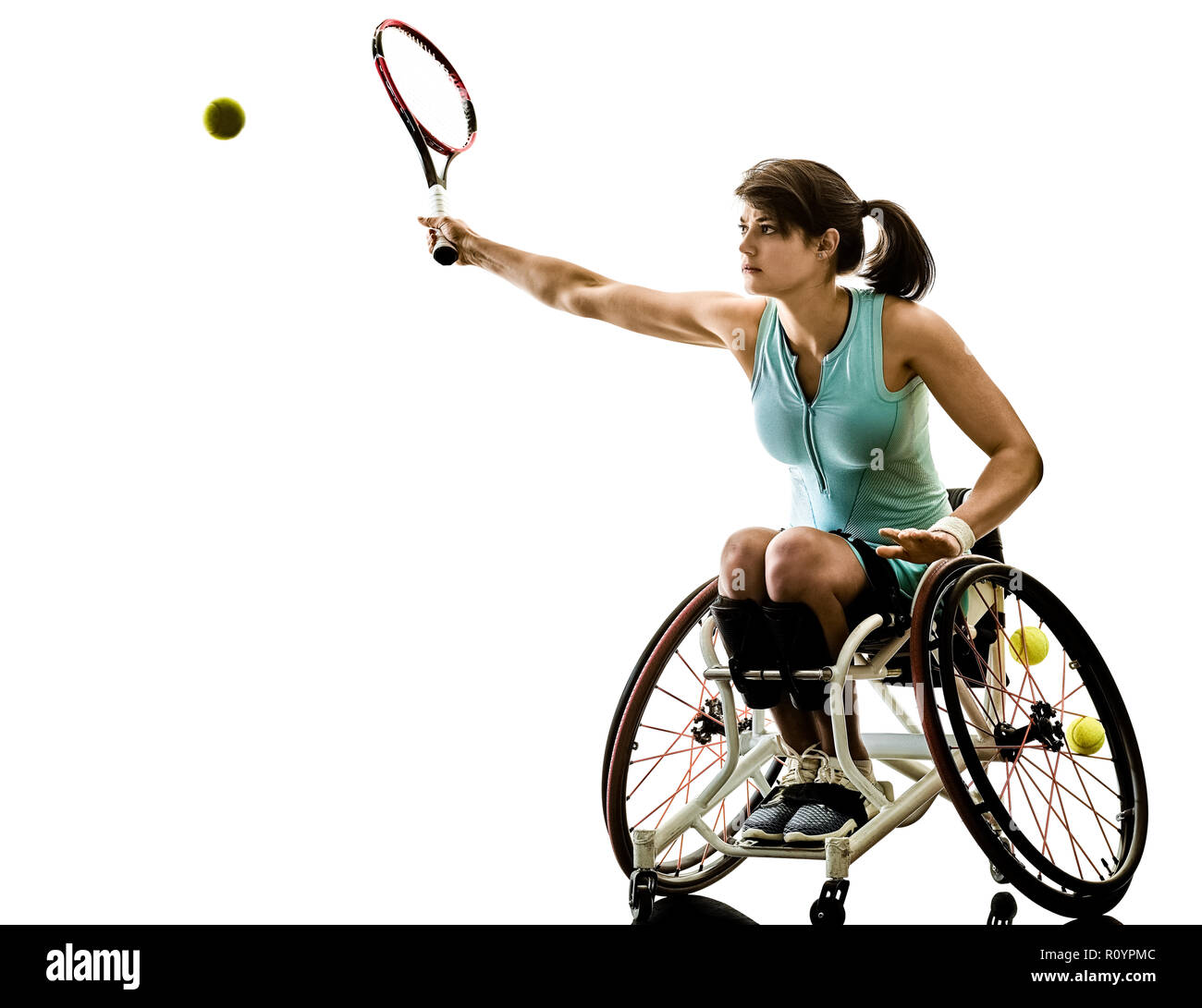 one caucasian young handicapped tennis player woman in wheelchair sport  tudio in silhouette isolated on white background Stock Photo