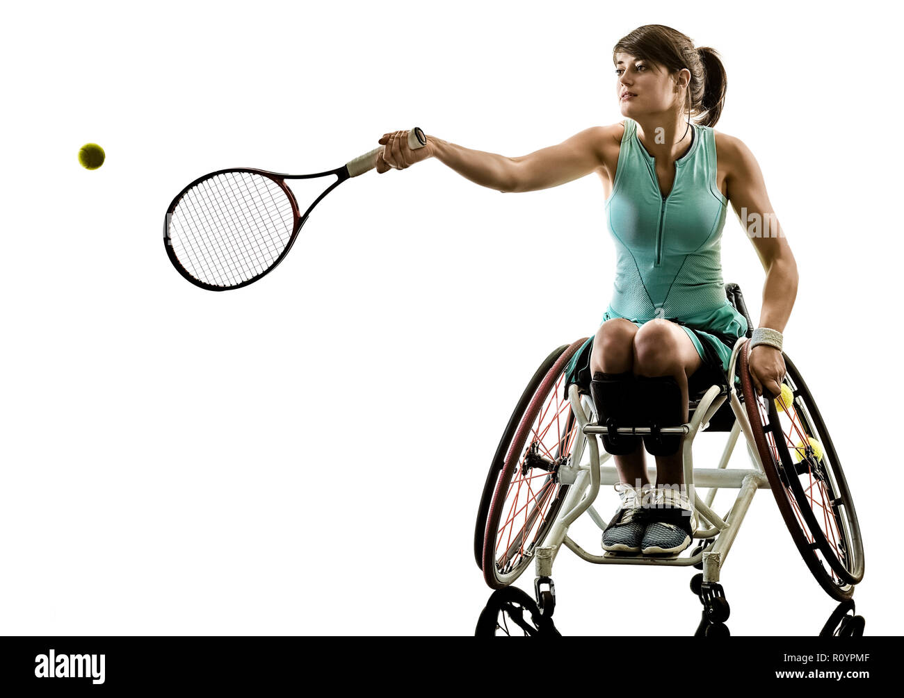 one caucasian young handicapped tennis player woman in wheelchair sport  tudio in silhouette isolated on white background Stock Photo