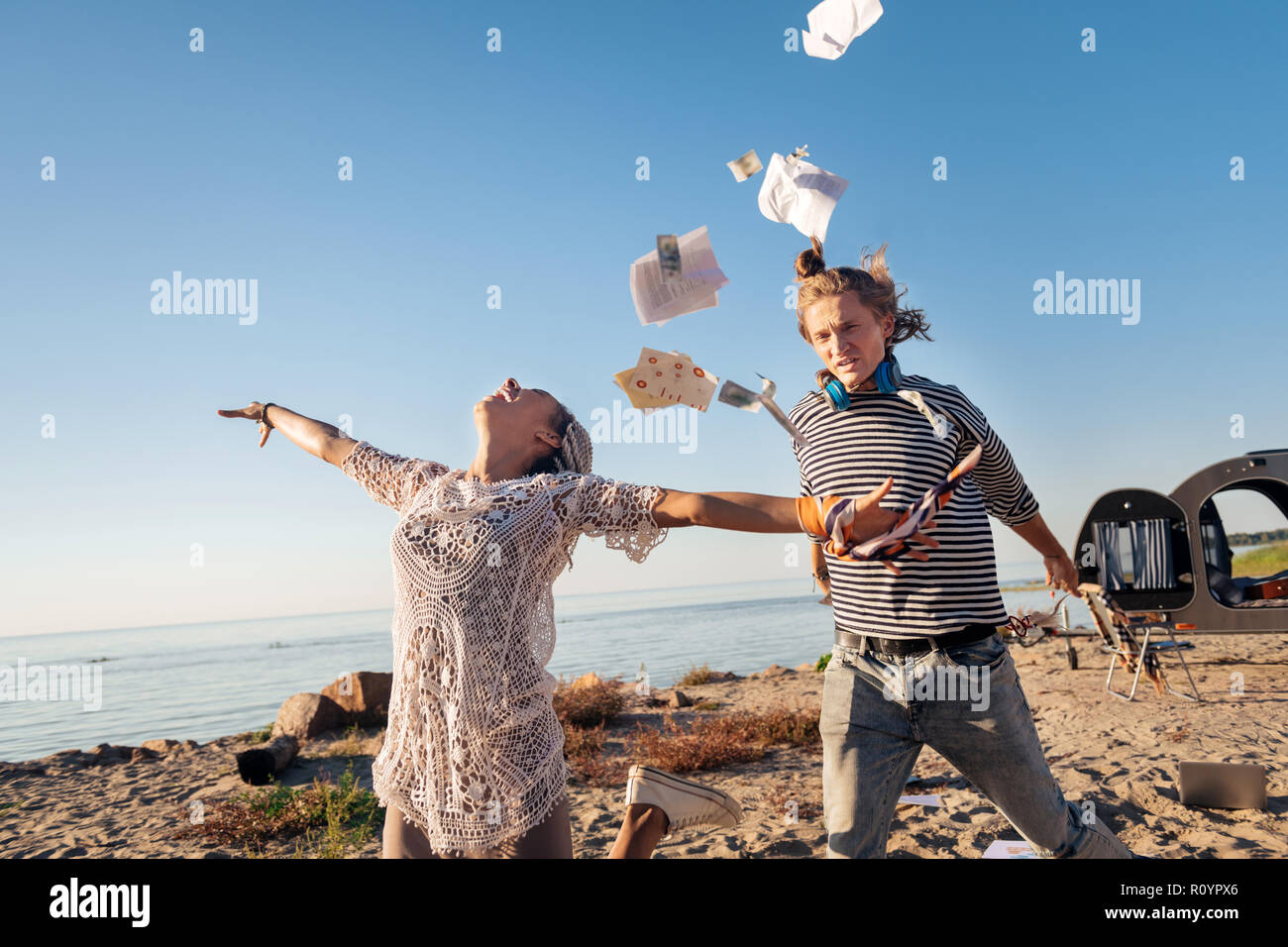 Crazy couple feeling excited while deciding to travel all around the world Stock Photo