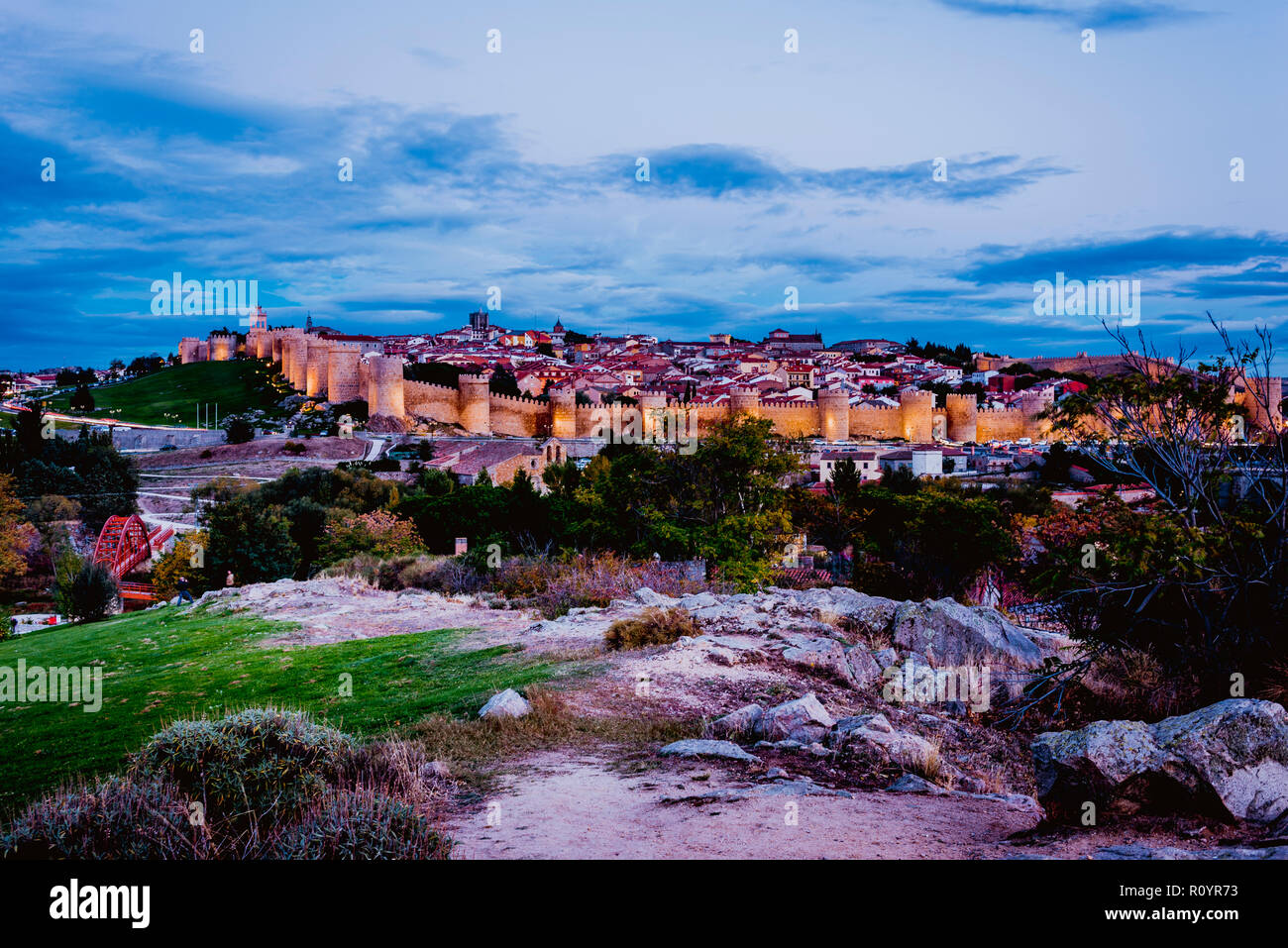 View from Cuatro Postes over the medieval city walls of Avila at dusk. Avila, Castilla y Leon, Spain, Europe Stock Photo