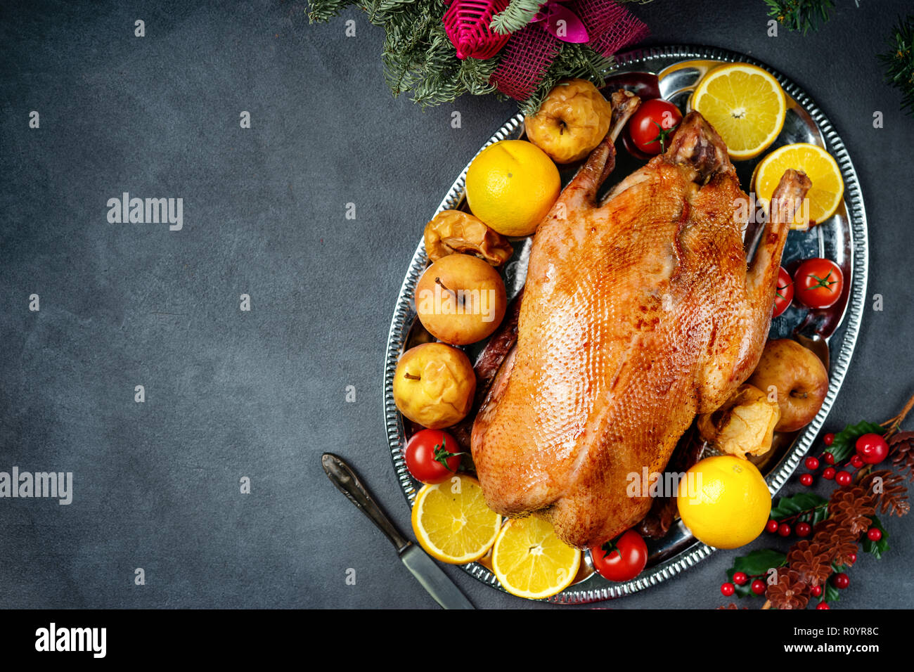 Christmas roasted whole goose on rustic table Stock Photo