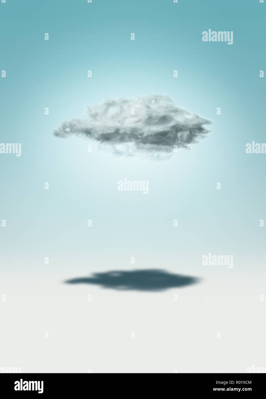 Shadow under low cloud against graduated blue sky background Stock Photo