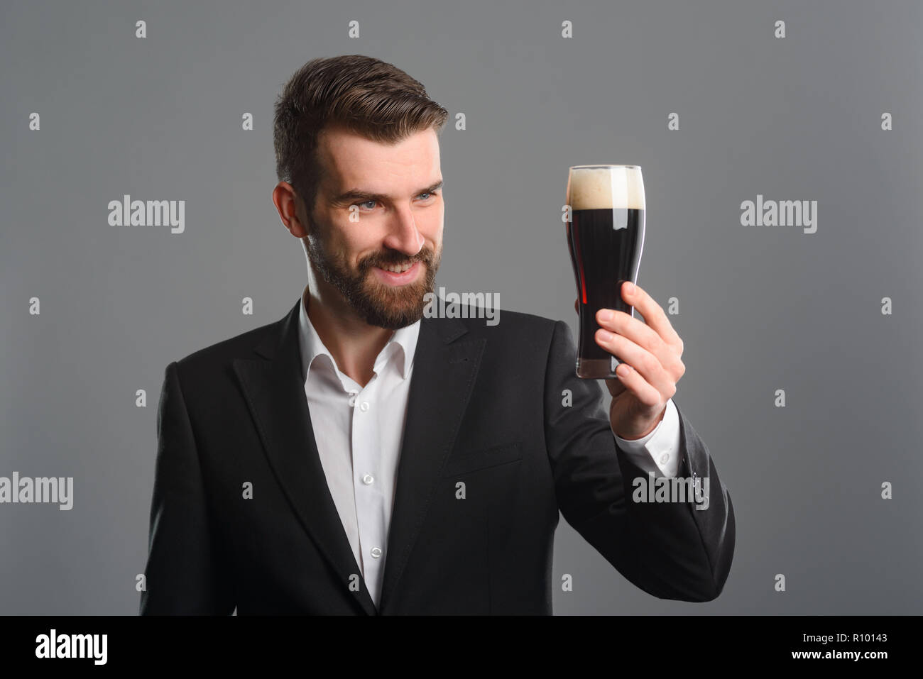 Man staring at beer glass Stock Photo