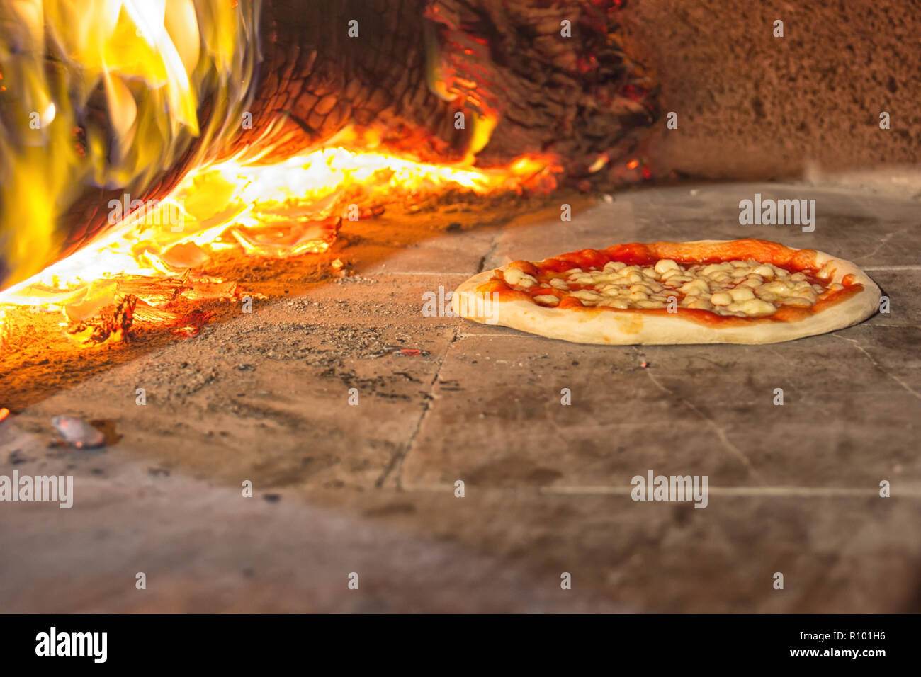 Pizza in stone oven, italian food Stock Photo Alamy