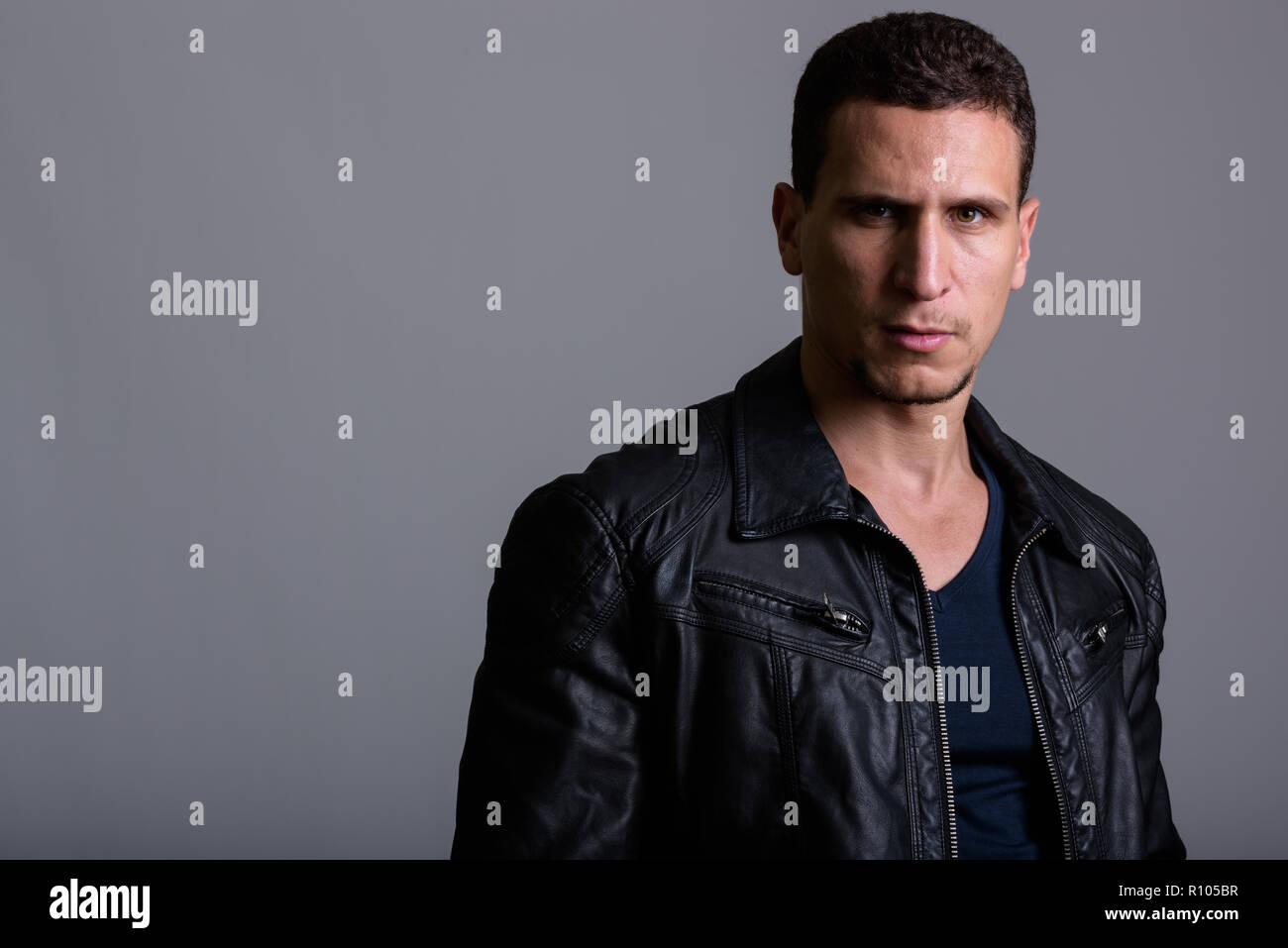 Muscular man in leather jacket hi-res stock photography and images - Alamy