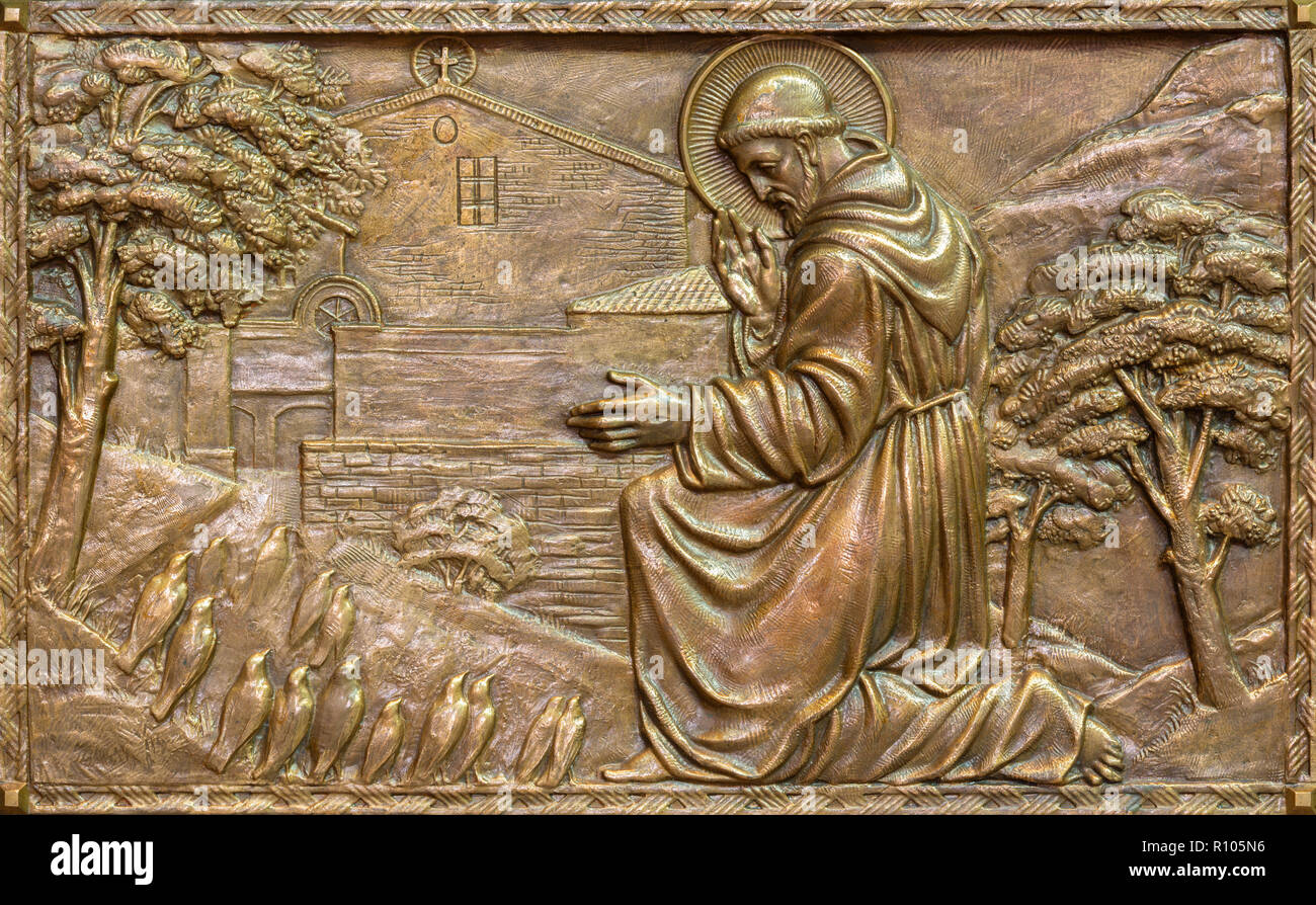 PRAGUE, CZECH REPUBLIC - OCTOBER 13, 2018: The bronze relief of Preaching to the birdsof St. Francis of Assisi  in church kostel Svateho Veclava Stock Photo