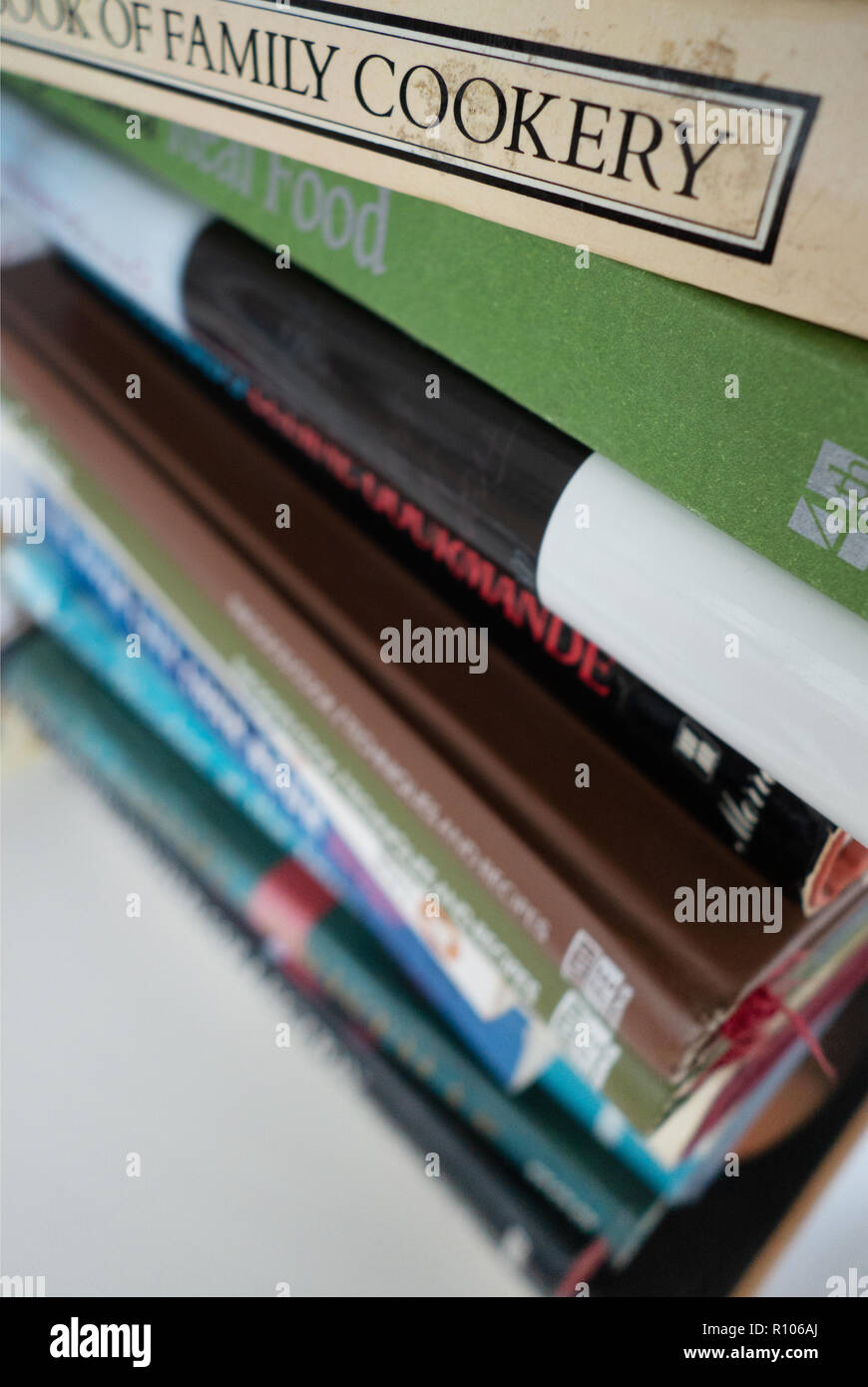 Selection of famous chefs Cookery Books on a shelf showing closeup of book titles Stock Photo