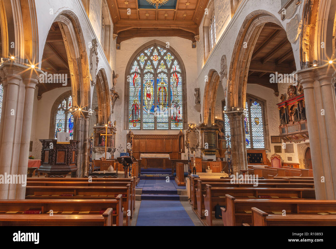 LONDON, GREAT BRITAIN - SEPTEMBER 20, 2017: The nave of church St. Olave with the stained glass by A. E. Buss (1953). Stock Photo