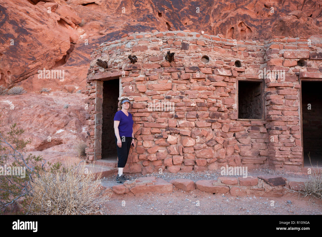 Woman Hiker Standing By The Cabins In Valley Of Fire State Park