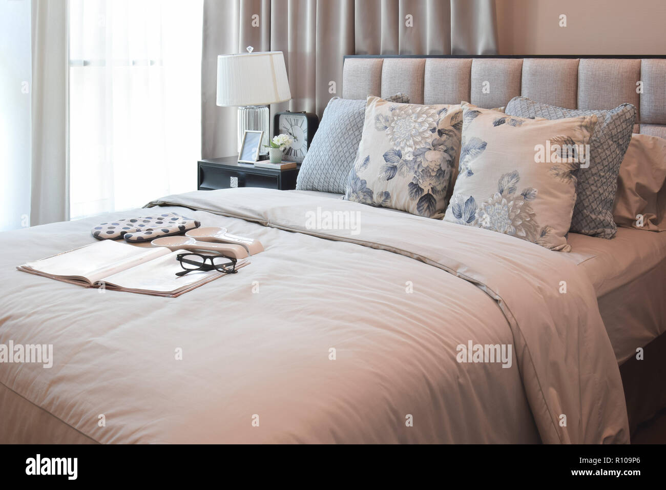 elegant bedroom interior design with floral pattern pillows on bed and ...
