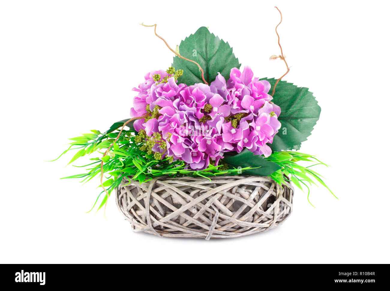 Pink fabric flowers in wicker basket isolated on white background Stock ...