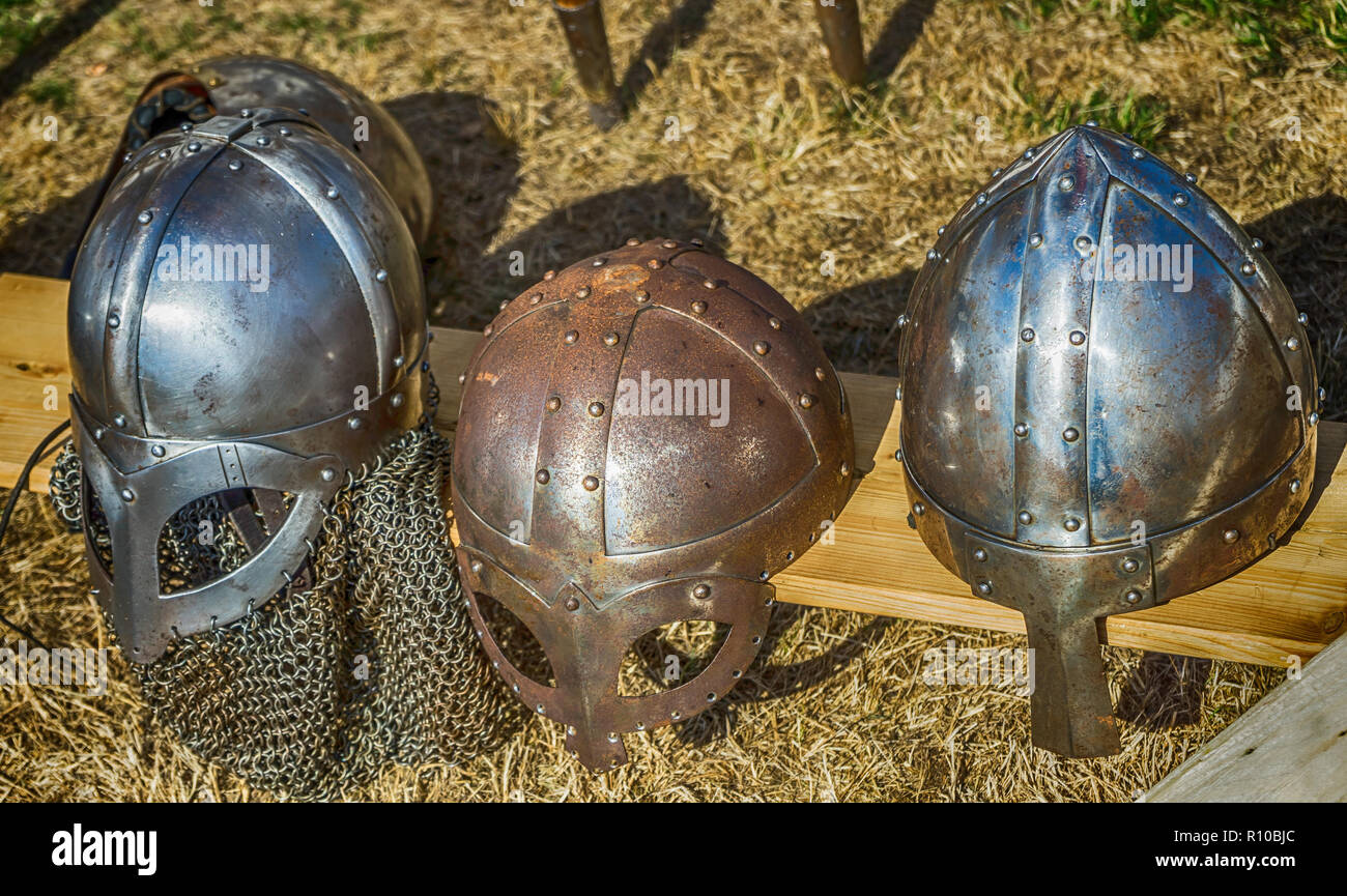 Three helmets with nose protection as worn by medieval knights in the Middle Ages. Stock Photo