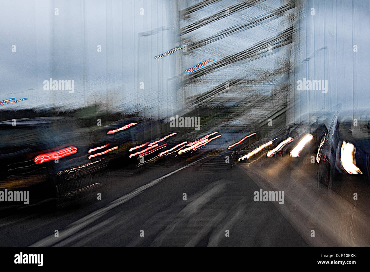 Blurred cars on Runcorn Bridge at dusk Stock Photo