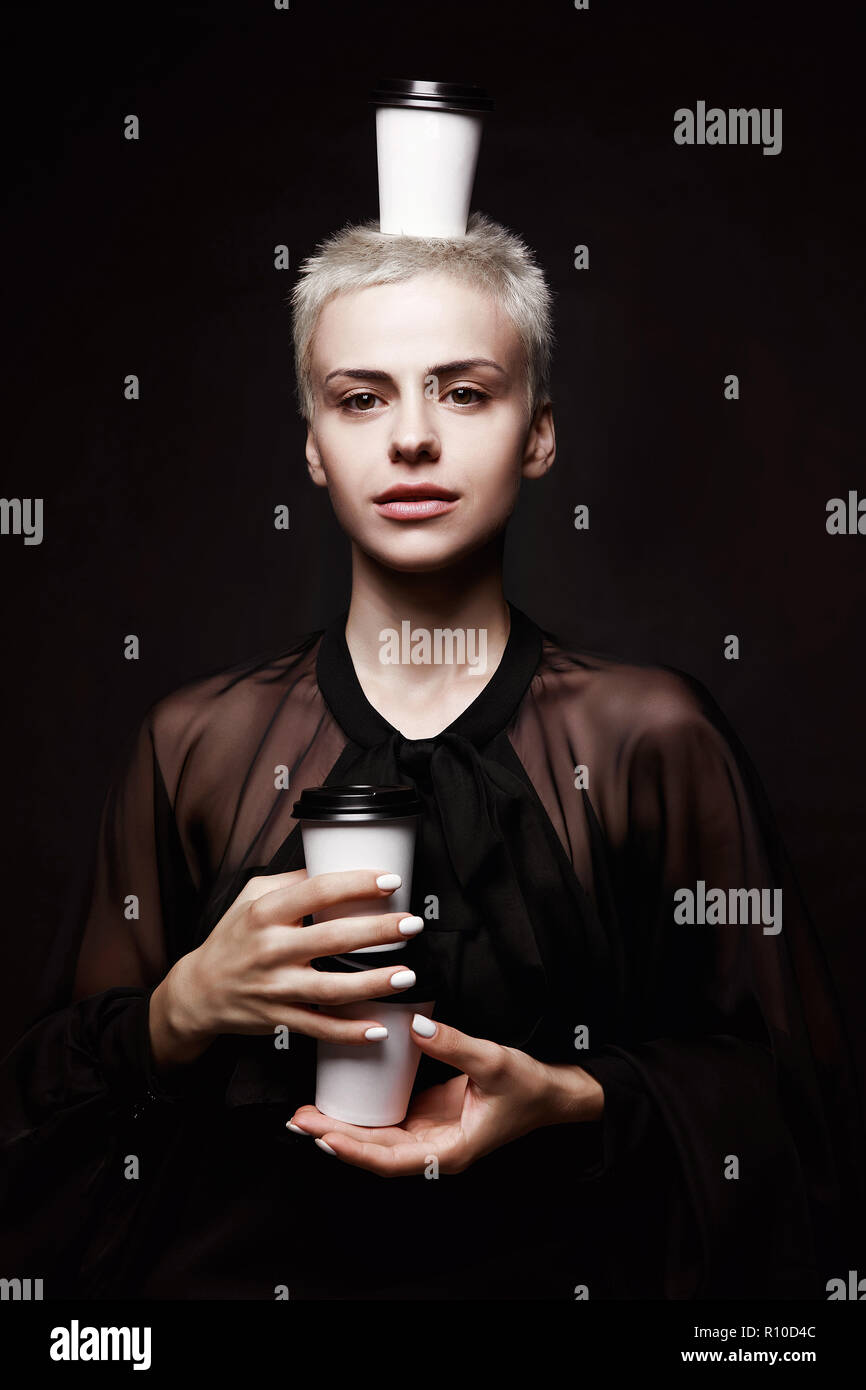 Emotional Young Girl With Short Hair And Paper Coffee Cups On
