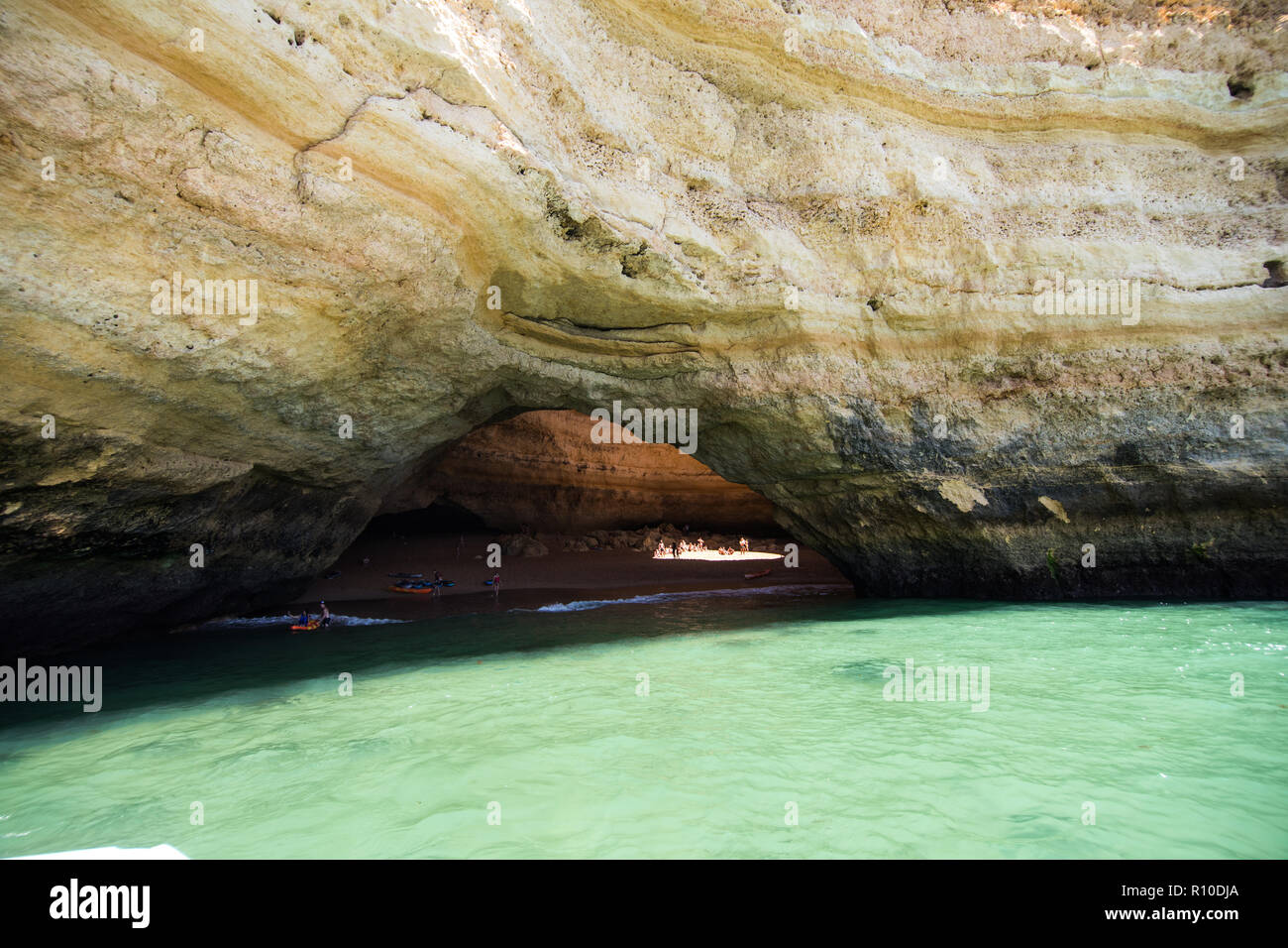 Benagil, Portugal - Juny, 2018: Benagil Cave Boat Tour inside Algar de Benagil, cave listed in the world's top 10 best caves. Algarve coast near Lagoa Stock Photo