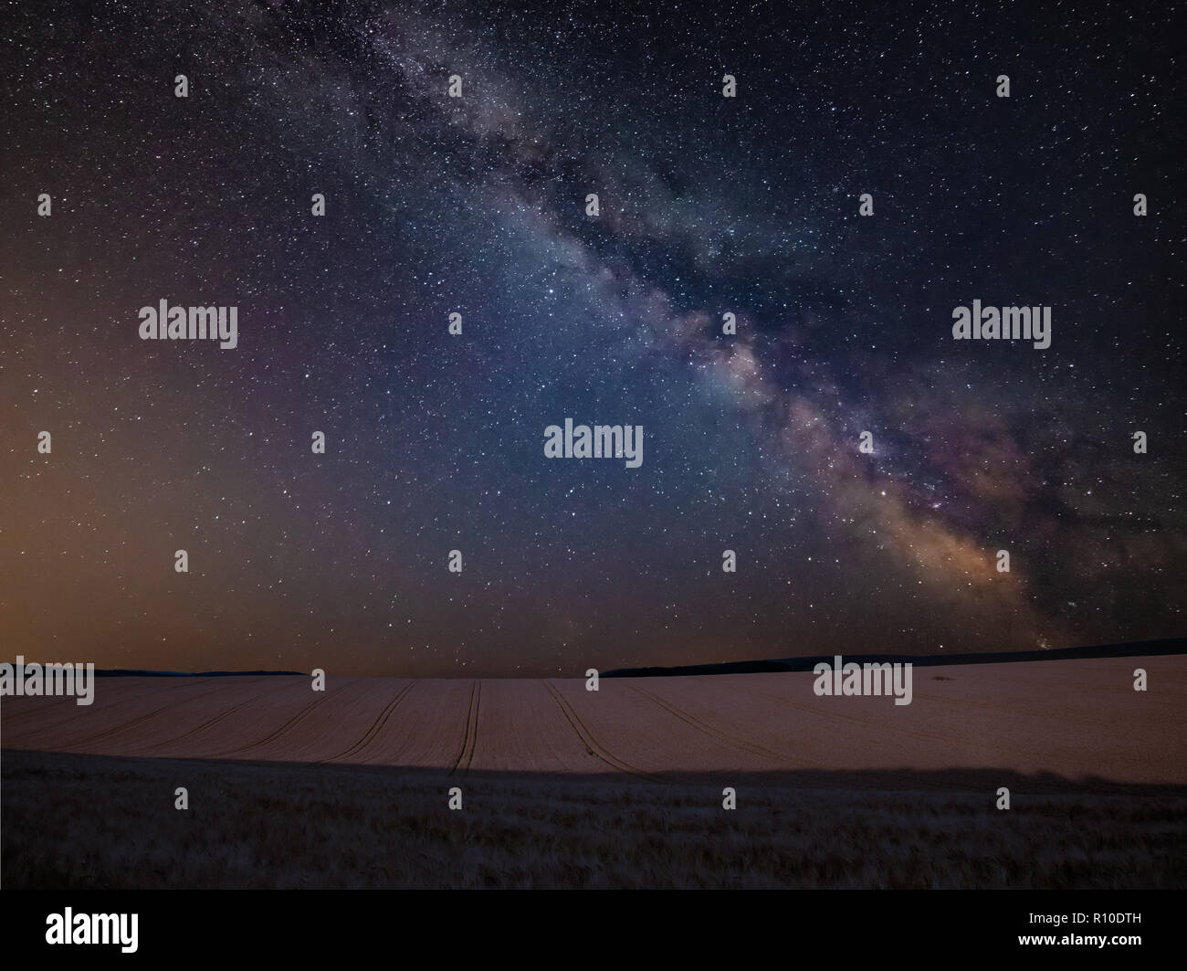 Stunning vibrant Milky Way composite image over landscape of wheat ...