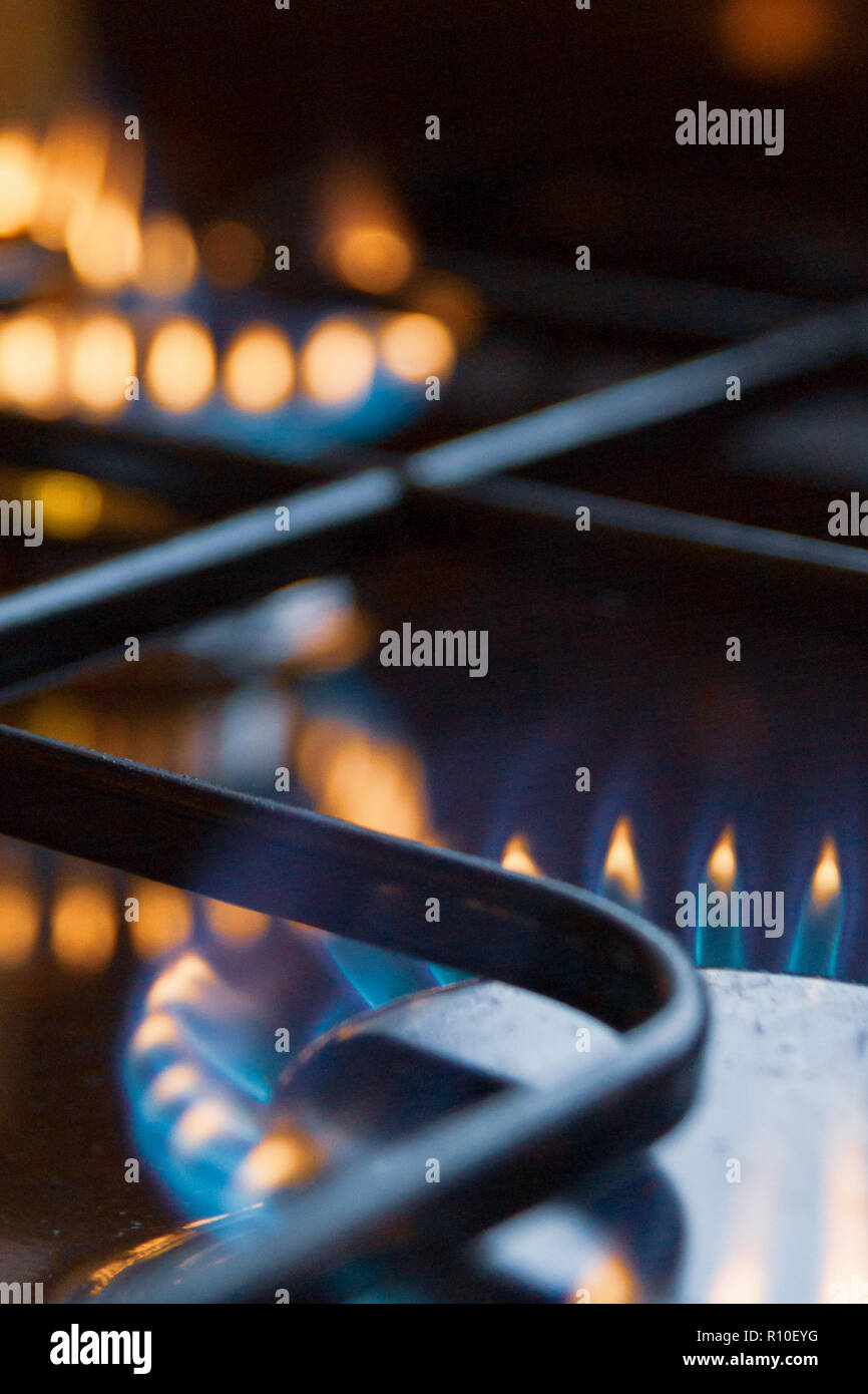 Gas stove with burning orange and blue fire on it Stock Photo Alamy