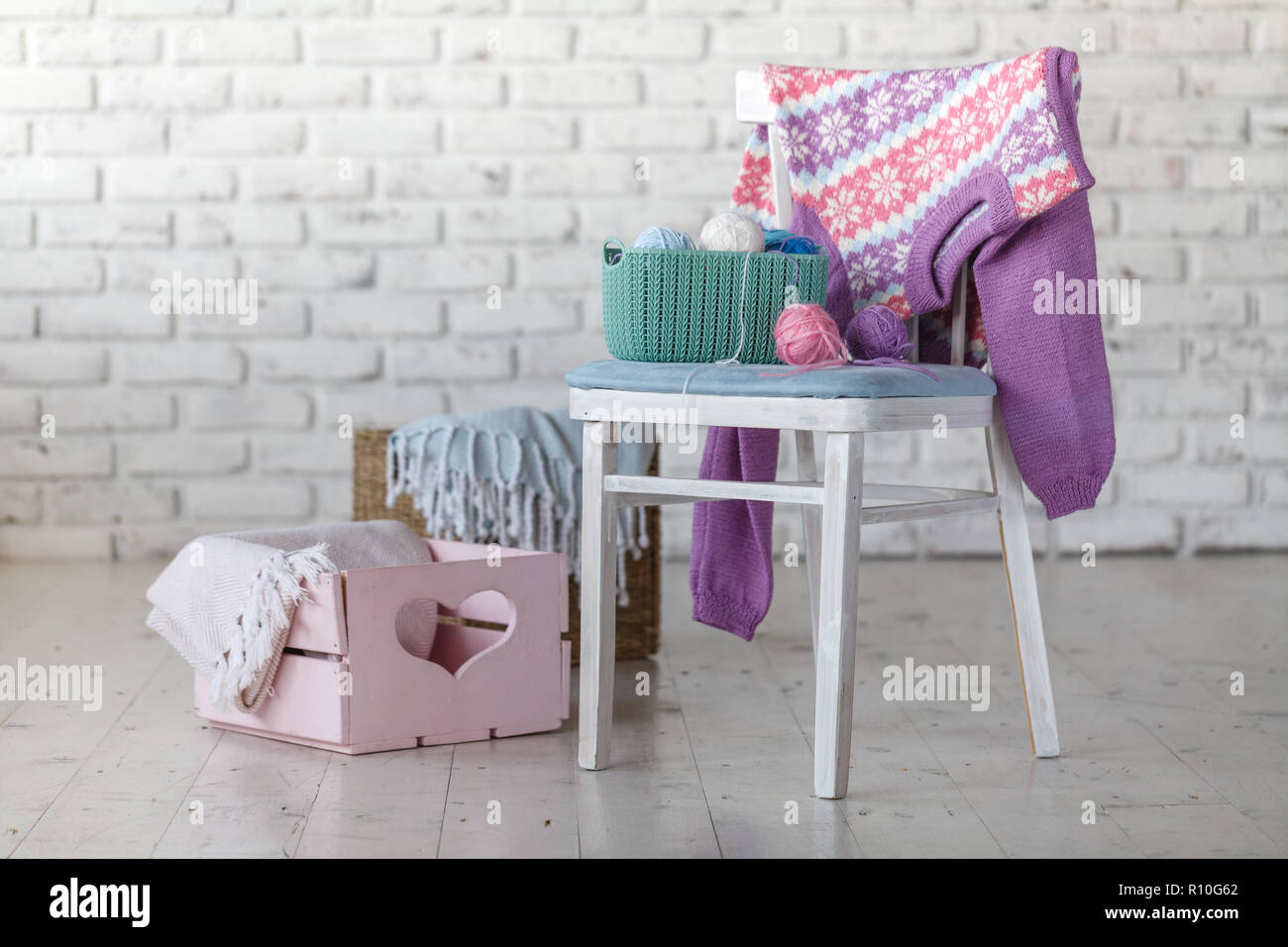 Baby Clothes On Chair In White Room Stock Photo 224362154