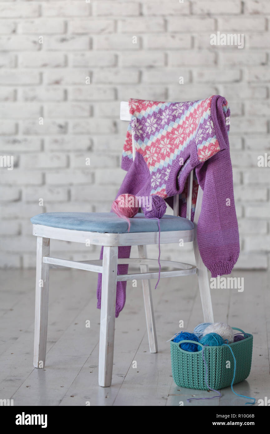 Baby Clothes On Chair In White Room Stock Photo 224362163